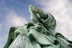 07-03 Statue Of Liberty Side View Of Her Enormous Hand Holding A Book With Folds Of Her Clothing From Pedestal.jpg